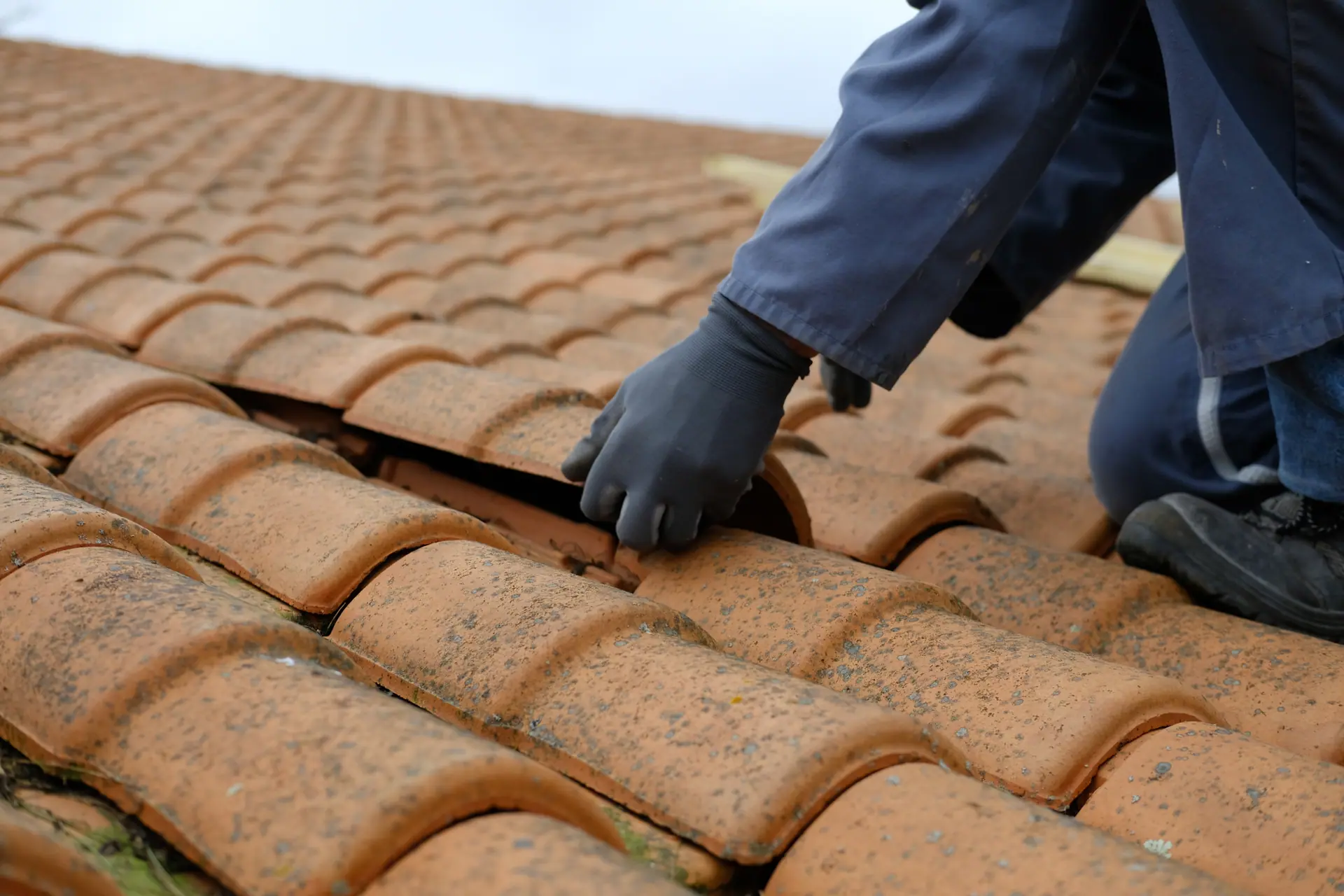 Roof tiles being fitted on a house in Wimborne by Apex Roofing Services