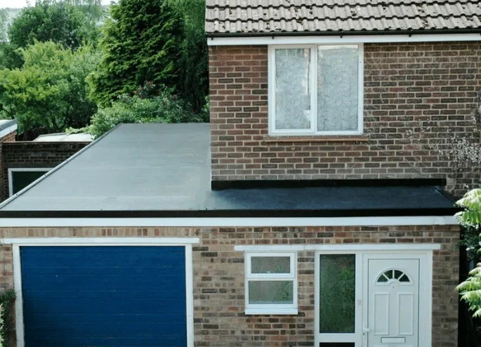 New dark roof tiles with uniform pattern and ridge caps fitted in Poole by Apex Roofing Services