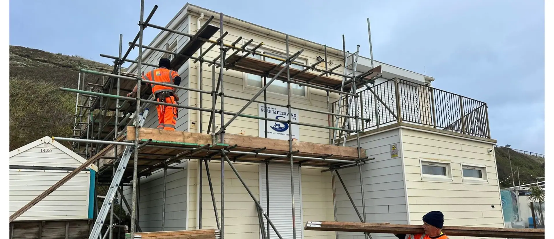 Roofers working on guttering in Bournemouth for Apex Roofing Services Ltd