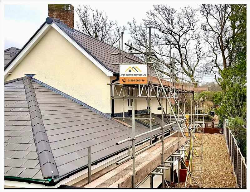Apex Roofing Services Ltd banner on scaffolding at a roofing project in Bournemouth