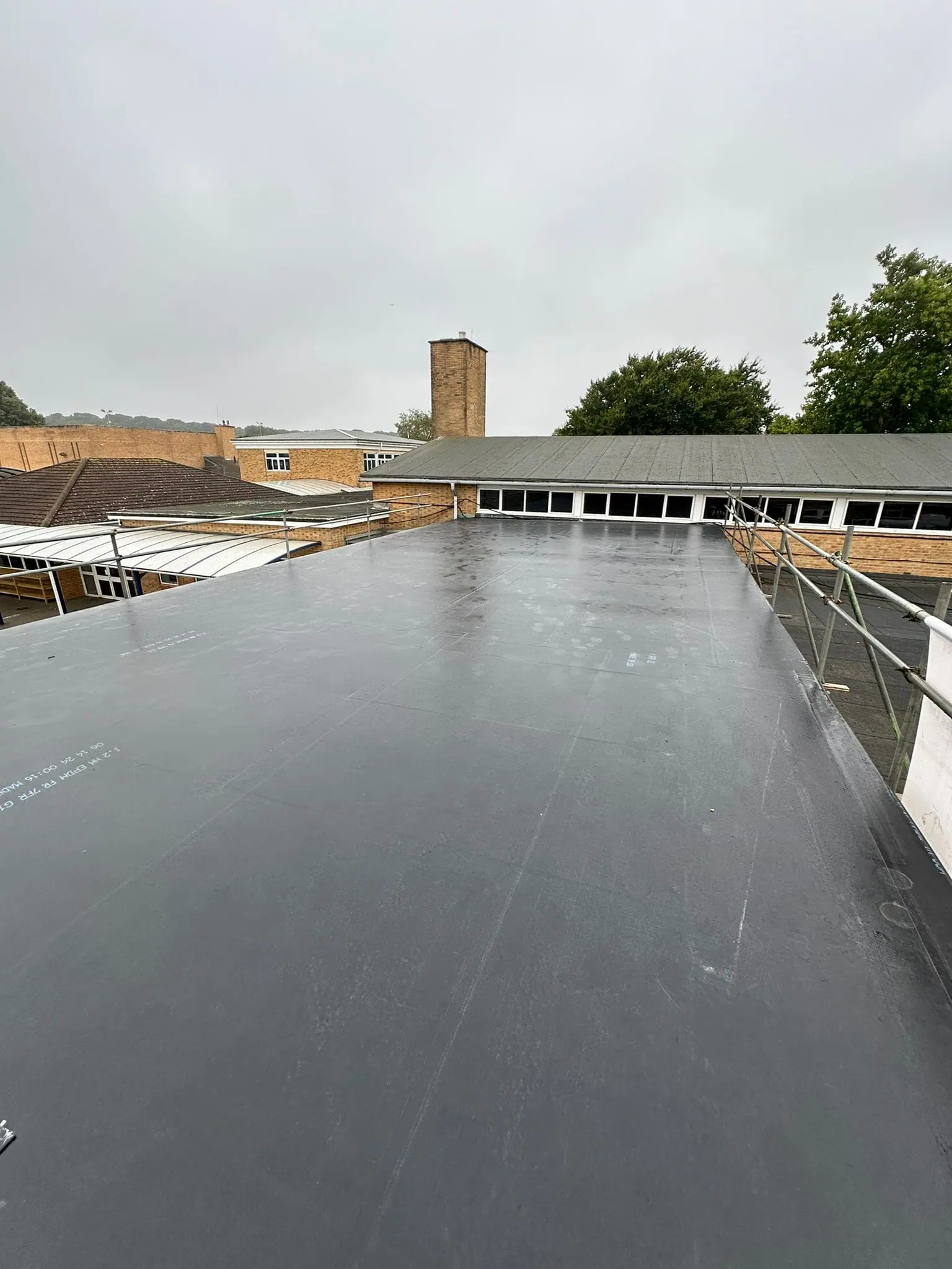 EPDM roof installation underway on a property in Bournemouth by Apex Roofing Services