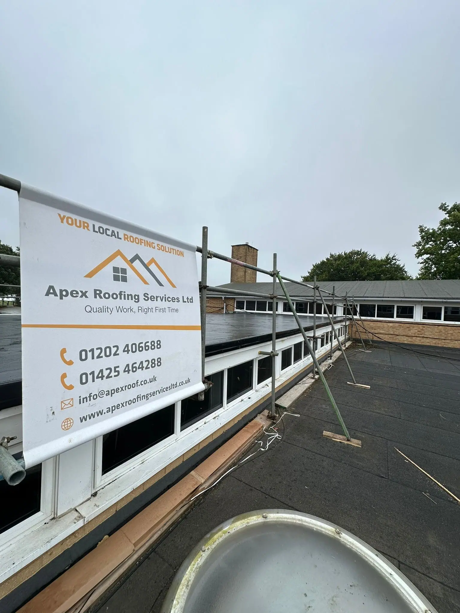 Apex Roofing Services sign on site at a roofing project in Poole