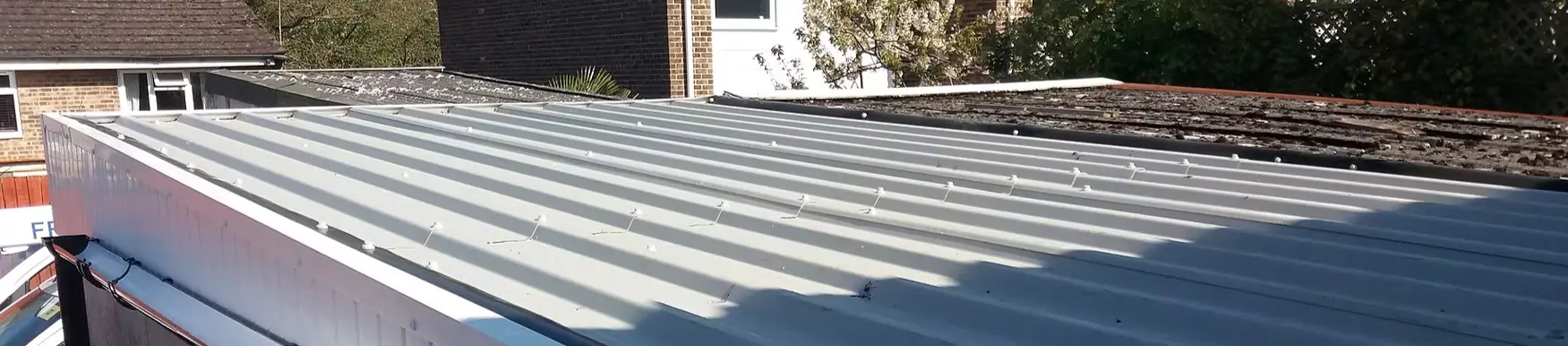 Sheet cladding installed across a building in Dorset by Apex Roofing Services