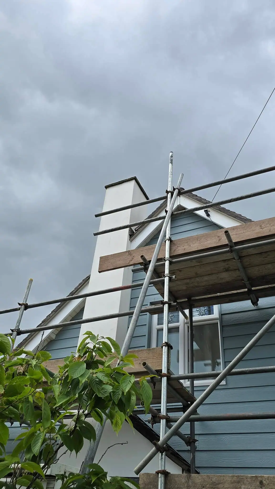 Exterior scaffolding used during a roof replacement project by Apex Roofing Services Bournemouth