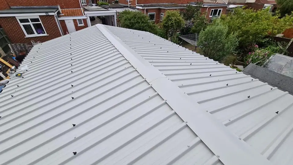 Completed sheet metal roof covering on a Dorset property by Apex Roofing Services